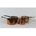 A miscellaneous collection of Household Items, comprising four copper saucepans each with iron handl... 