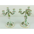 A pair of Meissen three branch Candelabra, with foliate sconces, decorated with flower encrusted ste... 