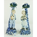 A pair of blue and white Sitzendorf Candlesticks, one of young girl holding a kid goat, and the othe... 