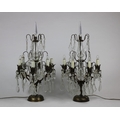 A pair of gilt metal and glass six  branch Candelabra Table Lamps, electrified, with glass stems and... 