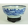 A large 18th Century Chinese blue and white Bowl, the outside with exterior scenes, the inside decor... 