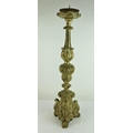 A tall antique carved wooden Pricket Candlestick, the silvered body on scrolled tri-form base, 75cms... 