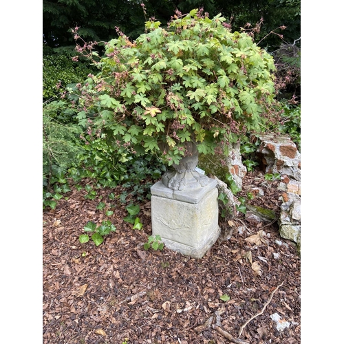 101 - A pair of Neo-classical composition Garden Urns & Plinths, each moulded with grotesque masks and... 