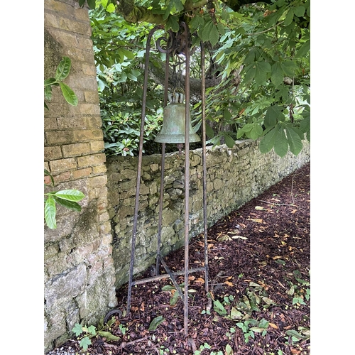 103 - A very heavy Victorian cast bronze Yard Bell, by Warner & Sons London 1874, on later tall wrough... 