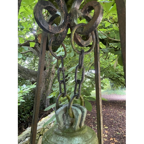 103 - A very heavy Victorian cast bronze Yard Bell, by Warner & Sons London 1874, on later tall wrough... 