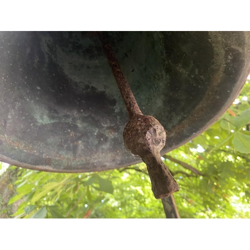 103 - A very heavy Victorian cast bronze Yard Bell, by Warner & Sons London 1874, on later tall wrough... 