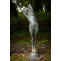A fine bronze Garden Figure, life size, modelled as a Nude Girl with arms crossed behind her head an... 