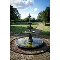 A green painted four tier cast metal Garden Fountain, each pan with a tongue and dart folded edge on... 