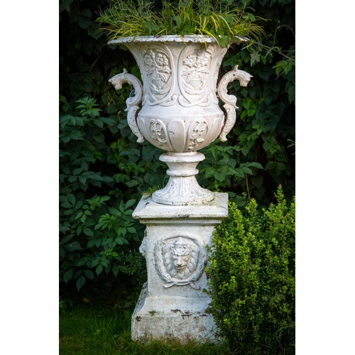 122 - A large heavy set of 4 unusual cast iron Garden Urns, each relief cast with vases of flowers and two... 