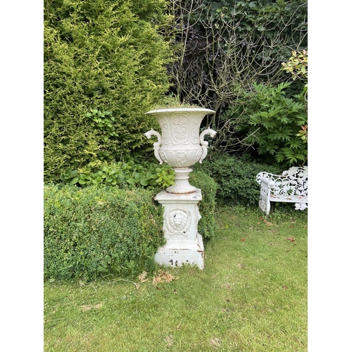 122 - A large heavy set of 4 unusual cast iron Garden Urns, each relief cast with vases of flowers and two... 