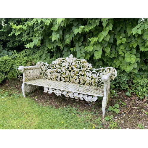 123 - A pair of heavy cast iron Garden Benches, each rustic open work back with scrolling oak leaves above... 