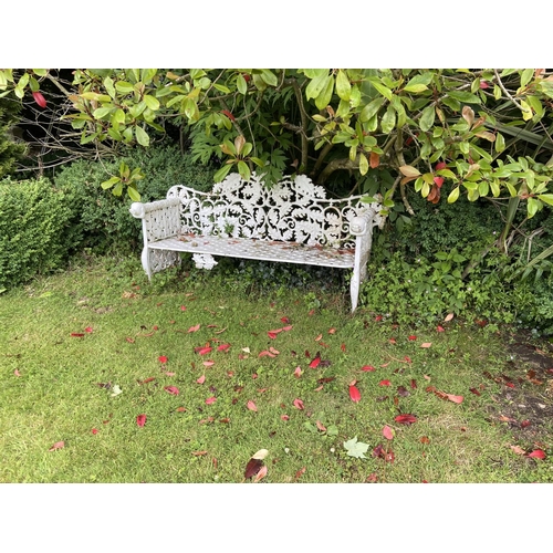 123 - A pair of heavy cast iron Garden Benches, each rustic open work back with scrolling oak leaves above... 