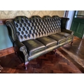 A button back four seater Wing Back Settee, covered in dark hide with four cushion seat on cabriole ... 