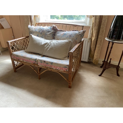 4 - A three piece Suite of wicker work Seat Furniture, comprising a two seater Settee and a pair of Armc... 