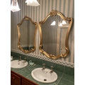An attractive pair of gilt cartouche shaped Mirrors, in scroll work frames, 44'' x 31'' (109cms x 79... 