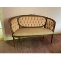 A French carved beech kidney shaped Settee, with triple panel back and ribbon moulded frame and padd... 