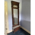 A 19th Century walnut Pier Mirror, with moulded cornice above a bevelled plate flanked with two turn... 