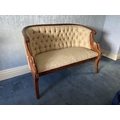 A Regency style carved mahogany Settee, with reeded top rail and button back, the moulded frame with... 