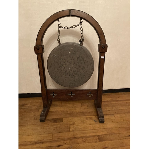 619 - A Victorian oak framed Gong, in the manner of Pugin, with brass bell united by a pierced stretcher, ... 