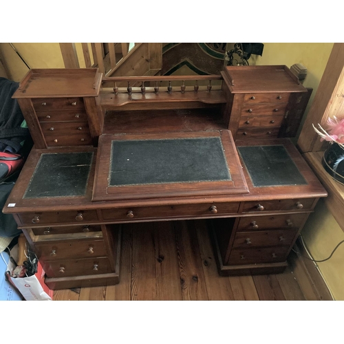 636 - A Victorian mahogany 'Dickens' Desk, in the manner of Strahan, with gallery back over a leather inse... 