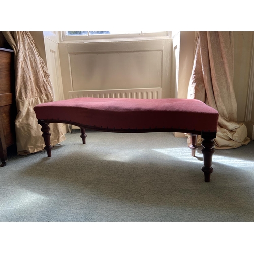 92 - A Victorian serpentine fronted Window Stool, covered in pink fabric on four turned legs, 44'' (112cm... 