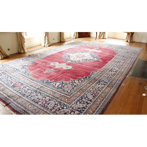 436 - A fine semi-antique burgundy ground Persian Carpet, the large centre medallion with stylized flowers... 