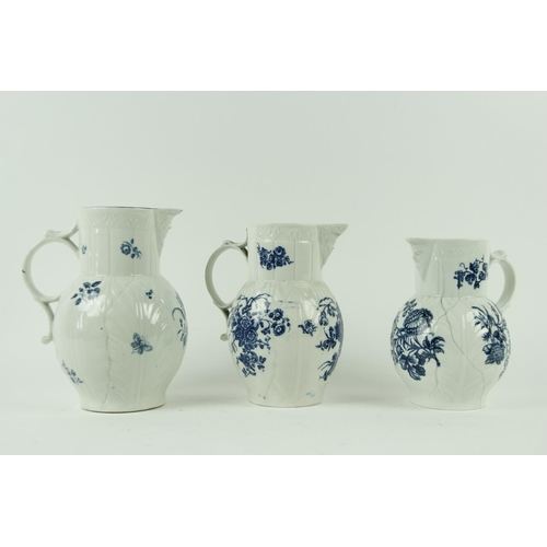 83 - A set of three 18th Century blue and white Worcester leaf moulded Mask Jugs, of graduating form, dec... 