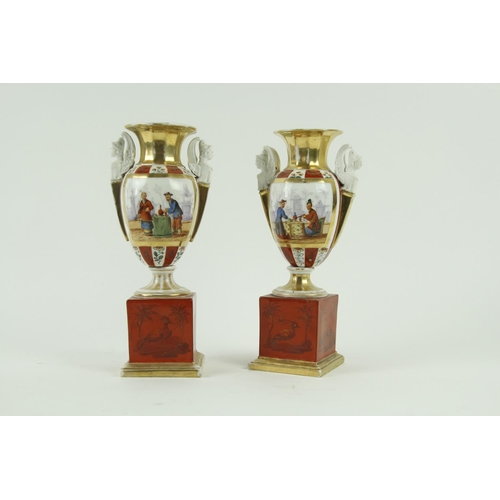 88 - A pair of 19th Century French porcelain two handled Urns, each decorated in the chinoiserie style fi... 