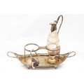 A George III silver boat shaped two compartment Cruet Stand, with one cutglass and silver mounted Ew... 