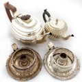 A small spiral reeded and silver plated 'bullet' Teapot, an oval plated half reeded Teapot, and a pa... 