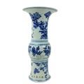 A large important Kangxi period blue and white Gu Vase, 18th Century, decorated with birds and flowe... 