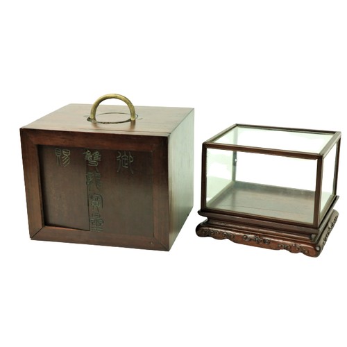 68 - A small unusual 19th Century Oriental teak Shrine Case, glazed on five sides, laid on a carved stand... 