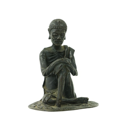 70 - An early Chinese or Tibetan bronze Figure, of a seated Buddha with hands resting on left knee, 4 3/4... 