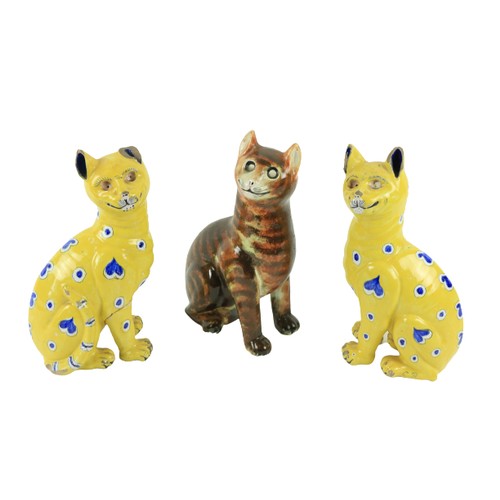 94 - A pair of Émile Gallé Smiling Cat Figures, in yellow glazed faience, c. 1890, each approx. 13