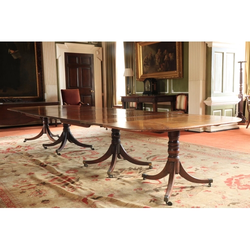 417 - A magnificent Georgian period mahogany Dining Table, on two quadruple centre pods, and two outer tri... 