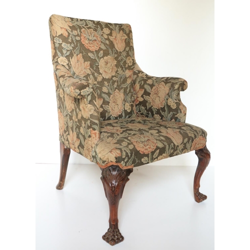 469 - An 18th Century Irish mahogany Library Armchair, with padded back and arms covered in floral tapestr... 