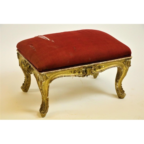 505 - An Irish Georgian period gilt and gesso Stool, in the rococo style with rectangular padded seat on f... 