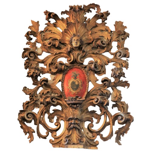 325 - A magnificent 18th Century Baroque carved Armorial Wall Piece, in the rococo style, the crest with s... 