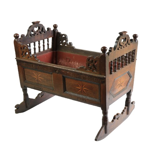 351 - An 18th Century oak Child's Rocking Cradle, the pierced ends with turned balustrades, above star inl... 