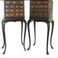 A pair of late 18th Century / early 19th Century black Japanned Chest on Stands, each with an arrang... 