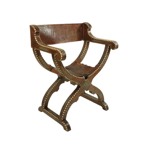 568 - A hip joint X frame Hispano Moresque Open folding Armchair, inlaid with bone and ivory and rows of s... 