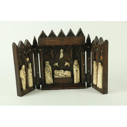 824 - An early carved wooden triptych Altarpiece, depicting the stable at Bethlehem, with the Infant Jesus... 