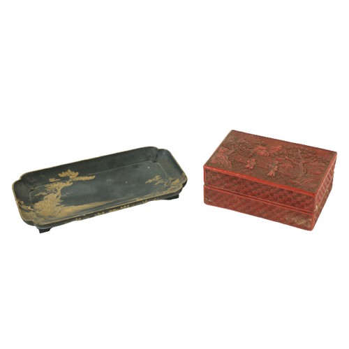 855 - A 19th Century rectangular red cinnabar Box and Cover, carved with two figures in a landscape 5 1/2