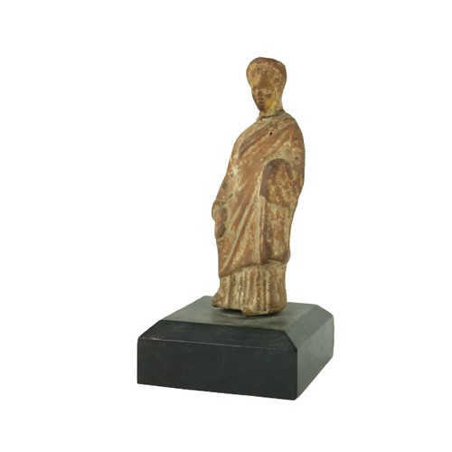 856 - An early classical Roman terracotta Figure, on associated base, 5 1/2