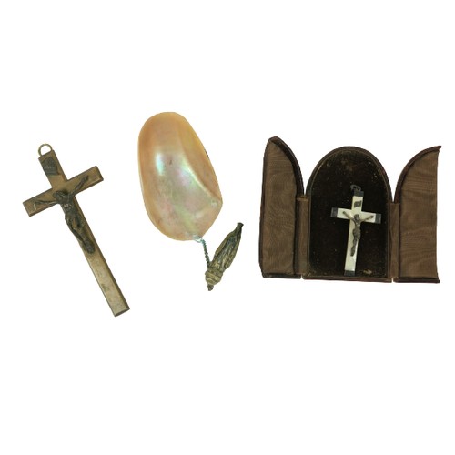 888 - A small mother-o-pearl and silver Crucifix, in arched leather table case, another large late Victori... 