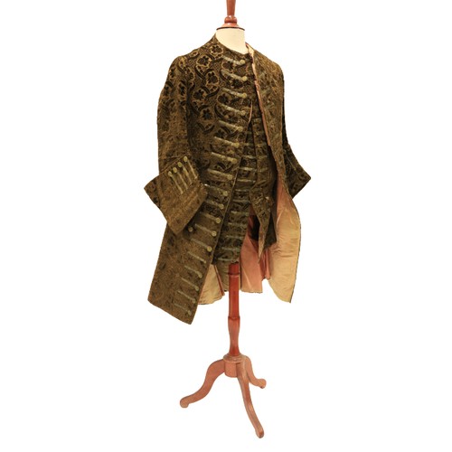 948 - A late 18th Century silk brocade brown Gentleman's Coat, with all over floral pattern, two side pock... 