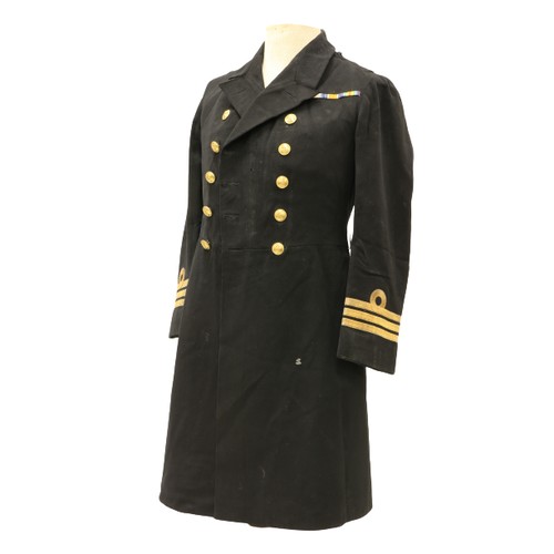 953 - A Royal Navy Officer's Uniform, with overcoat, jacket, pair of trousers, mess jacket, a pair of epau... 