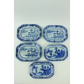 A set of three 18th Century Nankin blue and white porcelain Platters, decorated with boat houses and... 