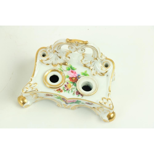 104 - A late 19thy Century oval shell shaped French porcelain Desk Stand, with floral decoration, 10 1/2