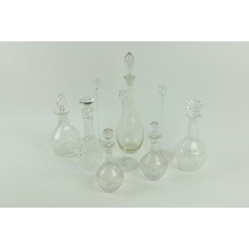 107 - Five various cutglass Decanters & Stoppers, various sizes, a plain glass bottle Decanter and sto... 